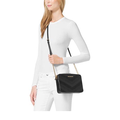 michael kors jet set travel schwarz weiß|michael kors jet set travel crossbody.